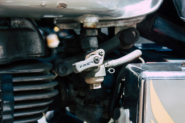Closeup of a motorcycle parked in the streets of the city center of the metropolitan area
