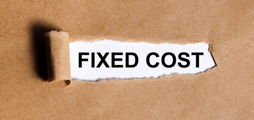 fixed cost. text on craft torn paper