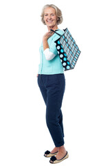 Fashionable old lady with shopping bag