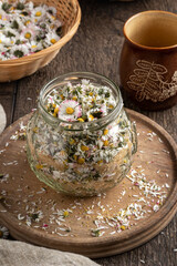 Preparation of homemade herbal syrup against cough from fresh common daisy flowers