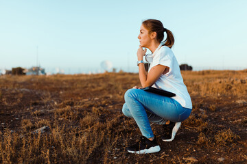 Young woman with her laptop listened external communications