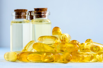 Health, vitamins and natural medicines - omega 3 capsules on a blue background.