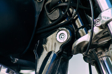 Closeup of a motorcycle parked in the streets of the city center of the metropolitan area
