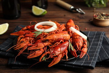 Delicious red boiled crayfishes on table, closeup