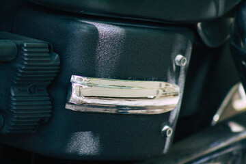 Closeup of a motorcycle parked in the streets of the city center of the metropolitan area

