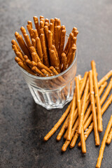 Salty sticks. Crunchy pretzels in glass