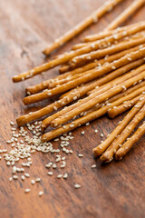 Salty sticks. Crunchy pretzels with sesame seeds