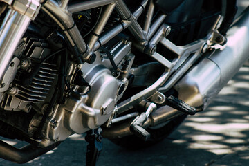 Closeup of a motorcycle parked in the streets of the city center of the metropolitan area