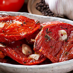 .Sun-dried tomatoes in a bowl with olive oil