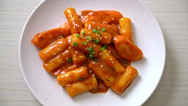 Korean rice cake stick with sausage in spicy sauce - Tteokbokki
