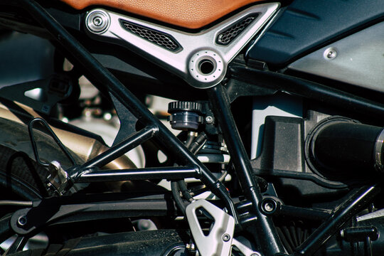 Closeup of a motorcycle parked in the streets of the city center of the metropolitan area
