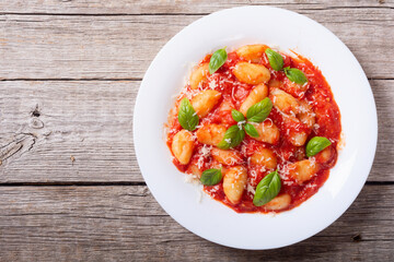 Italian homemade potatoes gnocchi with tomatoes sauce