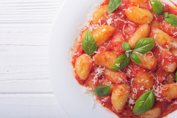 Italian homemade potatoes gnocchi with tomatoes sauce