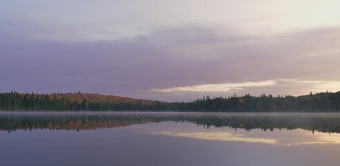 Reflection over Canisbay Lake in Algonquin Provincial Park In Ontario , Canada