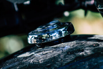Closeup of a motorcycle parked in the streets of the city center of the metropolitan area
