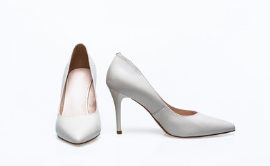 Fashionable women shoes isolated on white background. White high heel women shoes on white background. Stylish classic women leather shoe