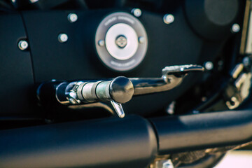 Closeup of a motorcycle parked in the streets of the city center of the metropolitan area
