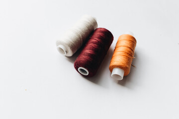 Colored thread for sewing isolated on white with copy space, 