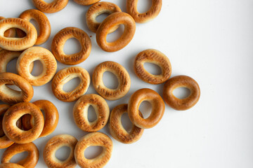 Pile of crispy cracknels isolated on white background, dessert for tea, baked dry bagels