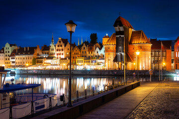 Fototapeta premium Historical Port Crane over the Motlawa river in Gdansk at dusk, Poland