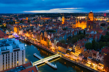 Obraz premium Aerial view of the Gdansk city over Motlawa river with amazing architecture at dusk, Poland