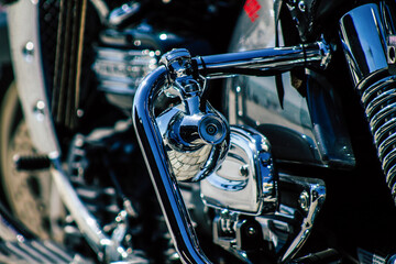 Closeup of a motorcycle parked in the streets of the city center of the metropolitan area
