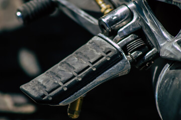 Closeup of a motorcycle parked in the streets of the city center of the metropolitan area
