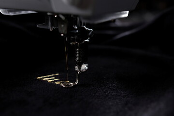 embroidery of gold lettering 