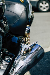 Closeup of a motorcycle parked in the streets of the city center of the metropolitan area
