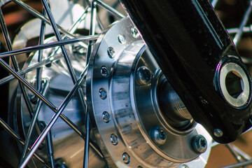 Fototapeta na wymiar Closeup of a motorcycle parked in the streets of the city center of the metropolitan area 