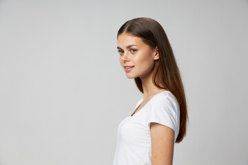 Pretty woman looking to the side white t-shirt cropped view 