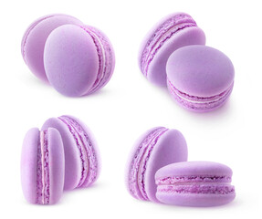 Fototapeta premium Isolated purple macaroons. Collection of two blueberry or blackberry macarons isolated on white background