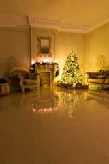 Luxury living room interior decorated with chic Christmas tree.