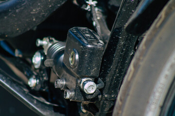 Closeup of a motorcycle parked in the streets of the city center of the metropolitan area
