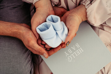 Beautiful pregnant couple hugging. Love and tenderness. The happiness of waiting. Close-up. Future child's notebook
