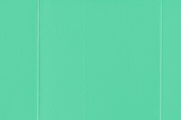 Fototapeta premium A vintage rough sheet of the carton with a gradient color. Recycled environmentally friendly retro cardboard paper texture. Simple and bright minimalist papercraft background.