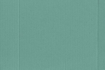 Fototapeta premium A vintage rough sheet of the carton with a gradient color. Recycled environmentally friendly retro cardboard paper texture. Simple and bright minimalist papercraft background.