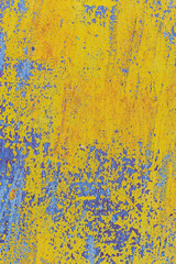 view of a patch of rusty iron with stains of old cracked yellow paint