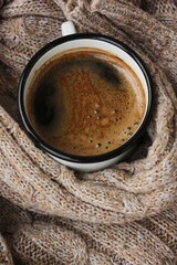 Americano coffee and a knitted sweater macro