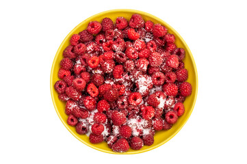 Fresh raspberry with sugar in yellow bowl. Isolated on white.