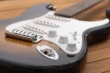 electric guitar on a wood table