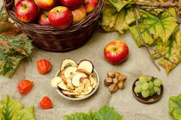 Dried apples, grapes, autumn leaves and some nuts