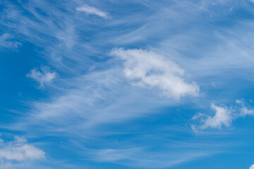 white clouds in the blue sky. Background