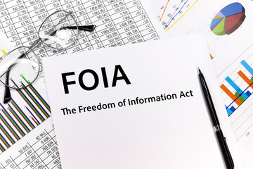 Paper with The Freedom of Information Act FOIA on a table