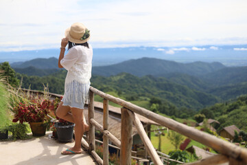 Fototapeta na wymiar Asian woman travel at mountainview at Khao Kho, Phetchabun province, Thailand
