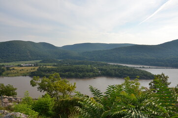 Fototapeta na wymiar View of the nature around the Hudson River with mountains and forests in sunny weather