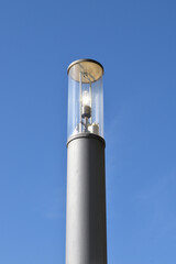 Close Up of Modern Street Lighting  Pole with Bulb against Blue Sky 