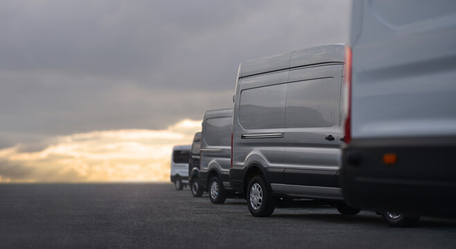 cargo vans in row on dealership parking