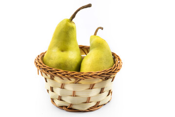 Wicker cute basket with pears harvest autumn on white isolated background