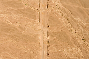 Desert path, high altitude aerial image.
